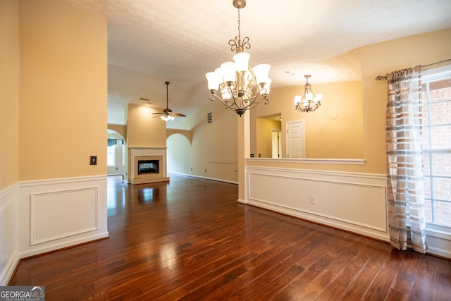 8640 Amberfield Dr, Gainesville, GA 30506 - unfurnished living room featuring hardwood / wood-style flooring, a wealth of natural light, and ceiling fan with notable chandelier