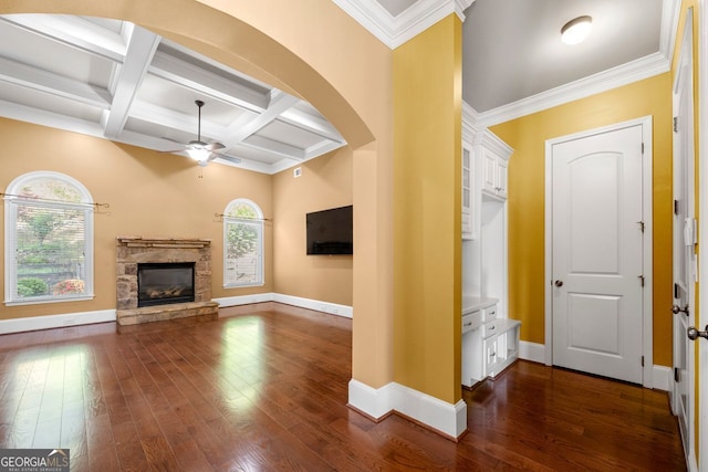 unfurnished living room with baseboards and a healthy amount of sunlight