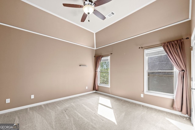 spare room with visible vents, carpet flooring, baseboards, and ceiling fan