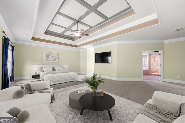 carpeted bedroom featuring ceiling fan, a raised ceiling, baseboards, ornamental molding, and visible vents