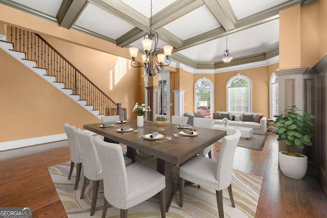 dining space with coffered ceiling, stairs, beam ceiling, a chandelier, and hardwood / wood-style flooring