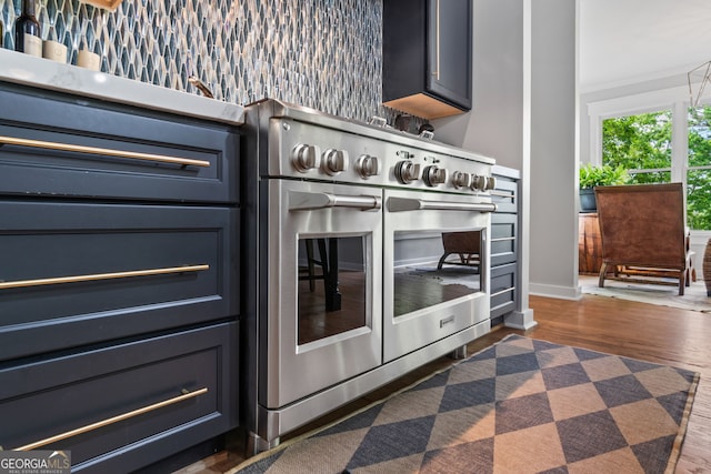 5527 Little River Cir, Gainesville, GA 30506 - kitchen view of double oven range, dark wood-style floors, and baseboards