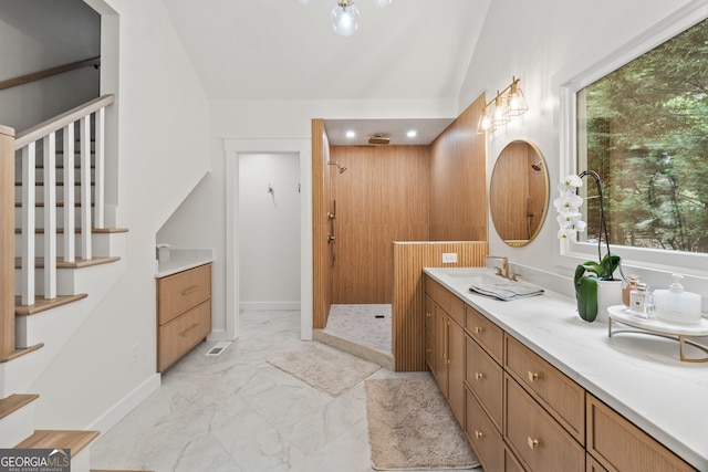 5527 Little River Cir, Gainesville, GA 30506 - full bathroom with marble look tile flooring, vanity, a walk in shower, baseboards, and vaulted ceiling