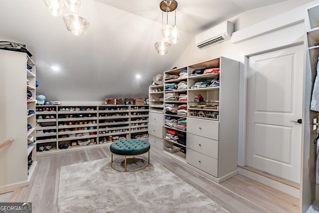 5527 Little River Cir, Gainesville, GA 30506 - spacious closet featuring an AC wall unit, wood finished floors, and vaulted ceiling