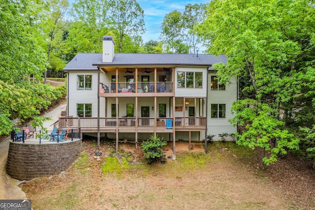 5527 Little River Cir, Gainesville, GA 30506 - rear view of house featuring a wooden deck, a chimney, a ceiling fan, and a balcony