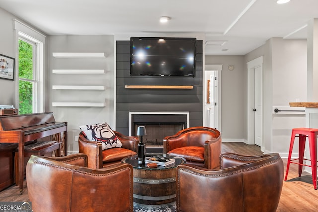 5527 Little River Cir, Gainesville, GA 30506 - living room with wood finished floors, a fireplace, and baseboards