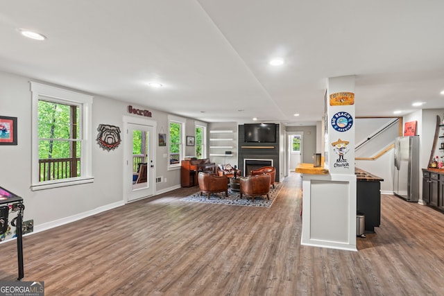 5527 Little River Cir, Gainesville, GA 30506 - living area featuring wood finished floors, baseboards, a fireplace, and recessed lighting