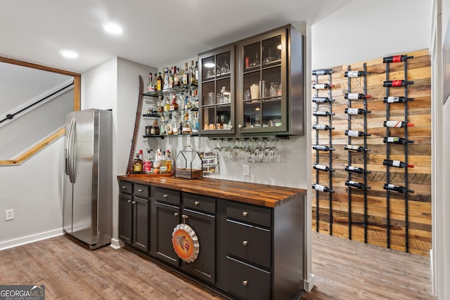 5527 Little River Cir, Gainesville, GA 30506 - wine area with light wood-style floors, a bar, and baseboards