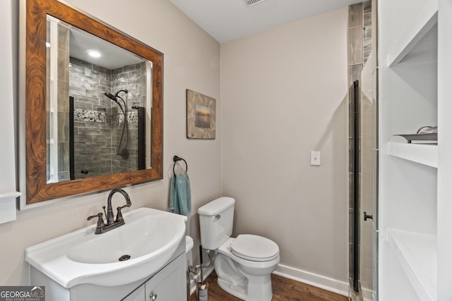 5527 Little River Cir, Gainesville, GA 30506 - bathroom with a tile shower, vanity, toilet, and wood finished floors