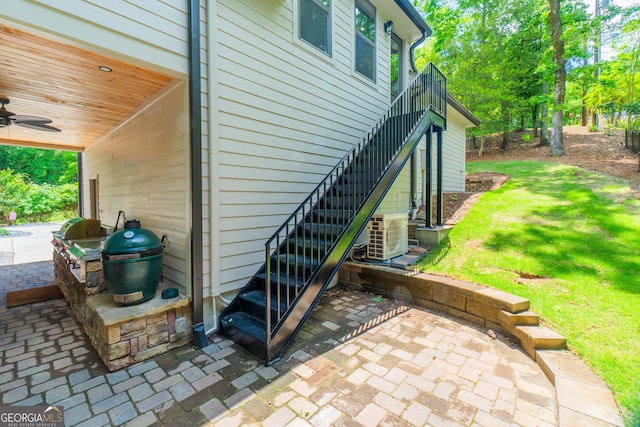 5527 Little River Cir, Gainesville, GA 30506 - view of side of home with stairway, a yard, central AC unit, and ceiling fan