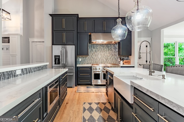 5527 Little River Cir, Gainesville, GA 30506 - kitchen featuring high quality appliances, a sink, under cabinet range hood, backsplash, and light stone counters