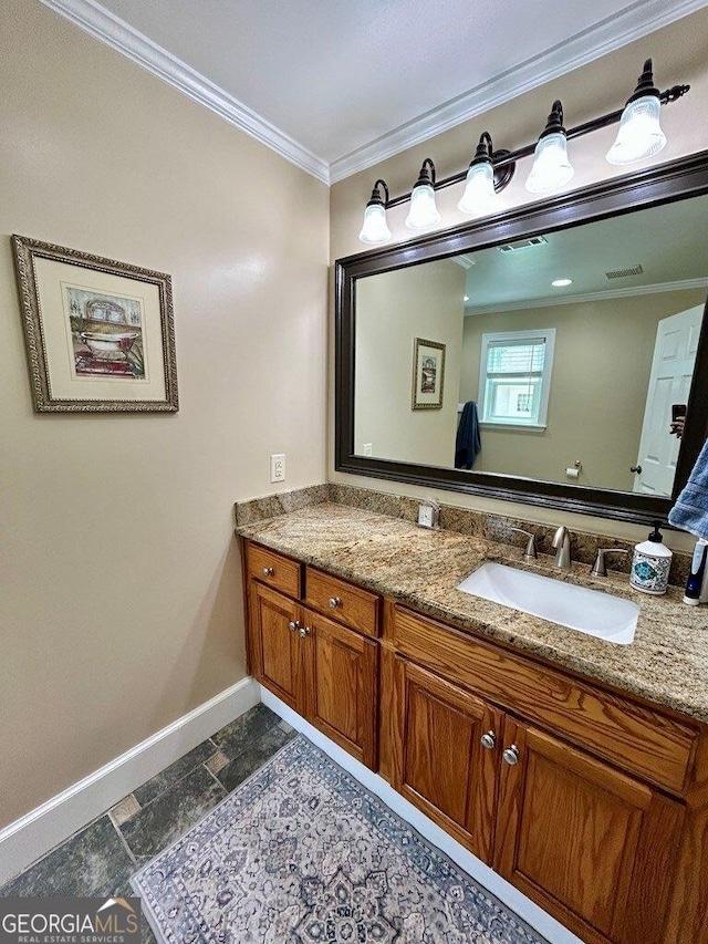 2118 Deer Run Cir, Tifton, GA 31793 - bathroom featuring baseboards, crown molding, vanity, and stone tile flooring