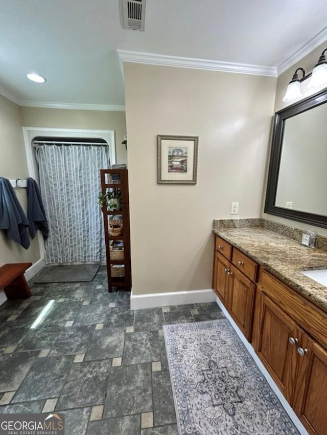 2118 Deer Run Cir, Tifton, GA 31793 - bathroom featuring baseboards, ornamental molding, vanity, and stone finish flooring