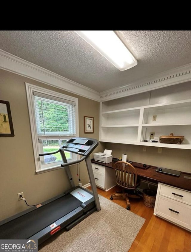 2118 Deer Run Cir, Tifton, GA 31793 - office area with a textured ceiling, crown molding, light wood-style flooring, and built in study area