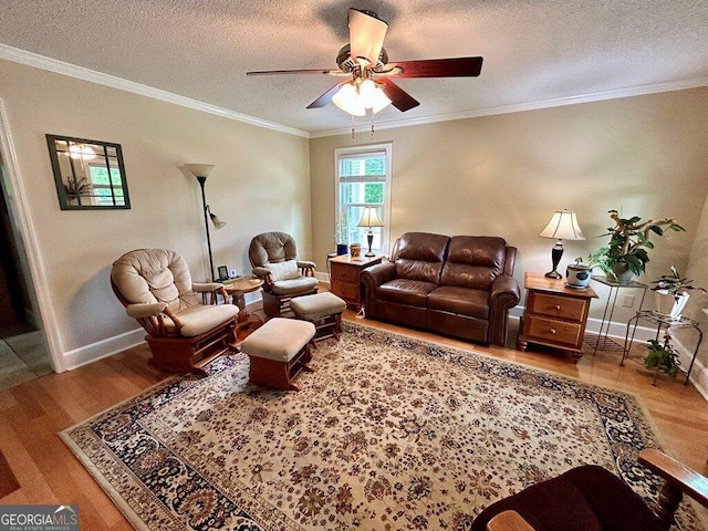 2118 Deer Run Cir, Tifton, GA 31793 - living room with wood finished floors, a ceiling fan, a textured ceiling, ornamental molding, and baseboards