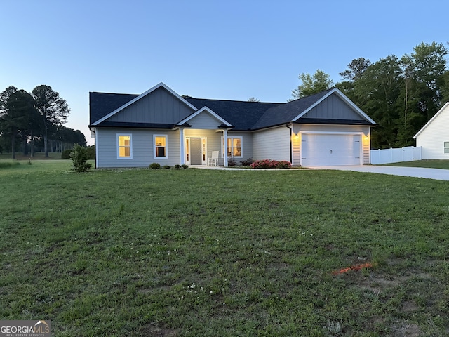 1575 Cabin Creek Trl, Griffin, GA 30223 - craftsman house featuring board and batten siding, a garage, fence, a front lawn, and concrete driveway