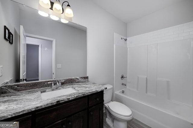1575 Cabin Creek Trl, Griffin, GA 30223 - bathroom featuring toilet, vanity, and bathing tub / shower combination