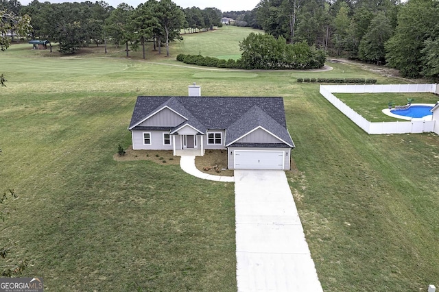 1575 Cabin Creek Trl, Griffin, GA 30223 - exterior space featuring concrete driveway, board and batten siding, fence, a front yard, and a garage