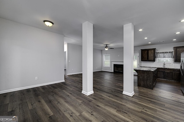 1575 Cabin Creek Trl, Griffin, GA 30223 - unfurnished living room with a ceiling fan, dark wood-style flooring, a fireplace, baseboards, and recessed lighting