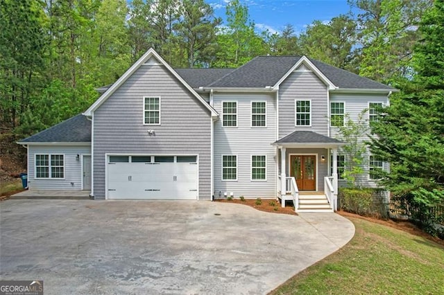 view of front of home featuring an attached garage and driveway
