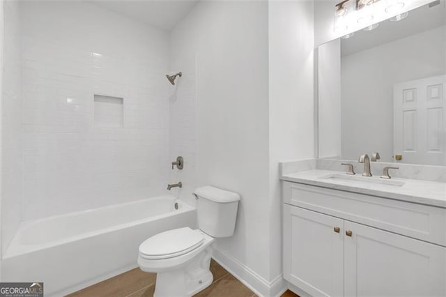 full bath with baseboards, shower / bathtub combination, toilet, and vanity