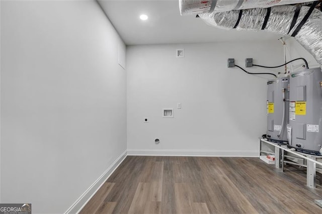 washroom featuring laundry area, wood finished floors, hookup for an electric dryer, and electric water heater
