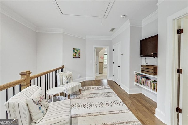 2244 Spink St NW, Atlanta, GA 30318 - living room featuring attic access, wood finished floors, and ornamental molding