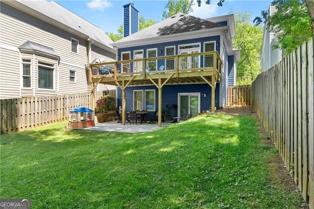 2244 Spink St NW, Atlanta, GA 30318 - rear view of property featuring a fenced backyard, a chimney, a patio, and a deck