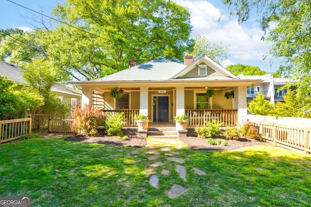 1426 Memorial Dr SE, Atlanta, GA 30317 - view of front of property with a front yard, a chimney, a fenced backyard, and covered porch