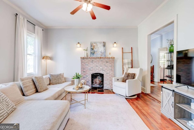 1426 Memorial Dr SE, Atlanta, GA 30317 - living room with light wood-style flooring, a brick fireplace, a ceiling fan, and ornamental molding
