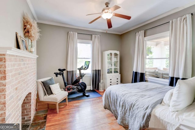 1426 Memorial Dr SE, Atlanta, GA 30317 - bedroom featuring a fireplace, wood finished floors, a ceiling fan, and ornamental molding