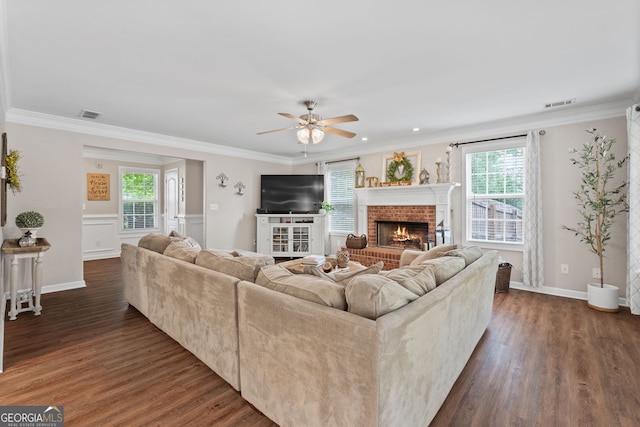 living area with dark wood-style flooring, a ceiling fan, and visible vents