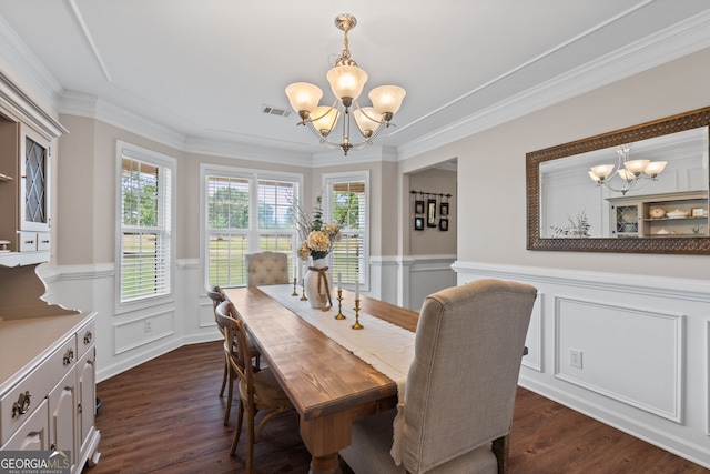 dining room featuring a decorative wall, dark wood-style floors, and an inviting chandelier