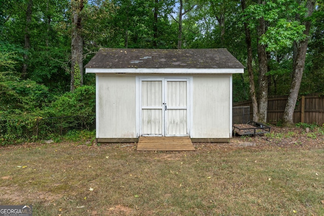 view of shed featuring a fenced backyard