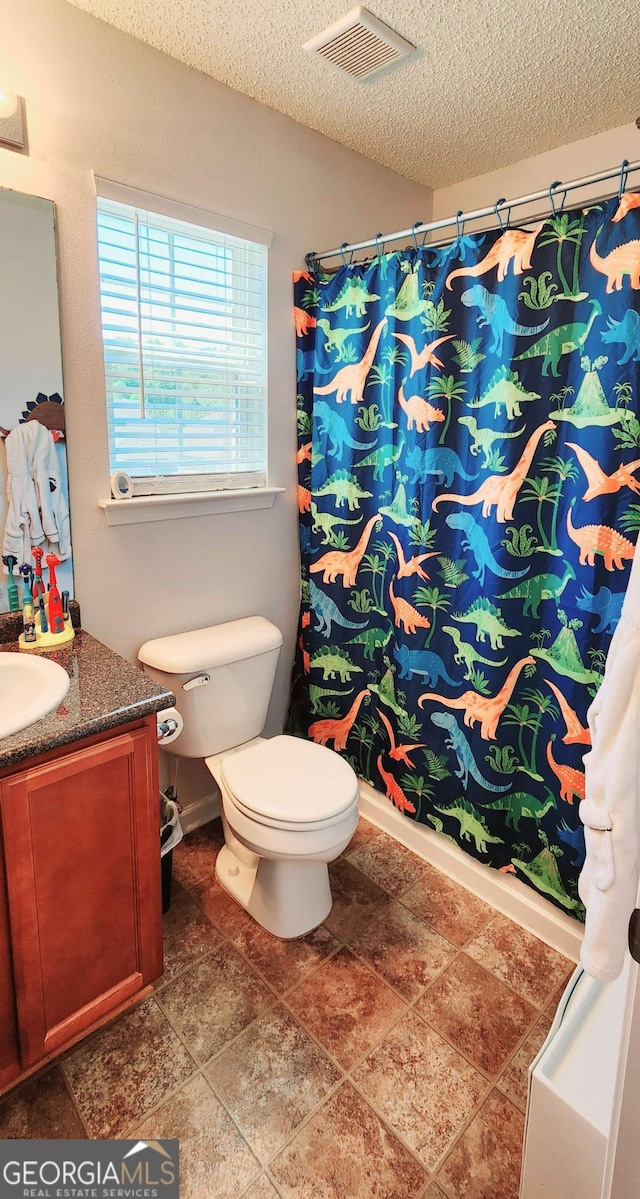 89 Tiller Way, Port Wentworth, GA 31407 - bathroom featuring visible vents, a textured ceiling, vanity, and toilet