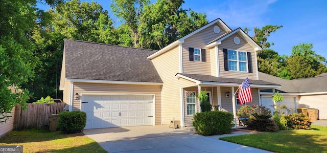 89 Tiller Way, Port Wentworth, GA 31407 - view of front of property featuring fence, concrete driveway, an attached garage, covered porch, and roof with shingles