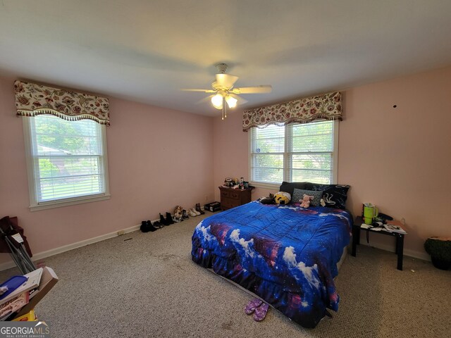 206 New Dr, Claxton, GA 30417 - bedroom featuring a ceiling fan, baseboards, and carpet