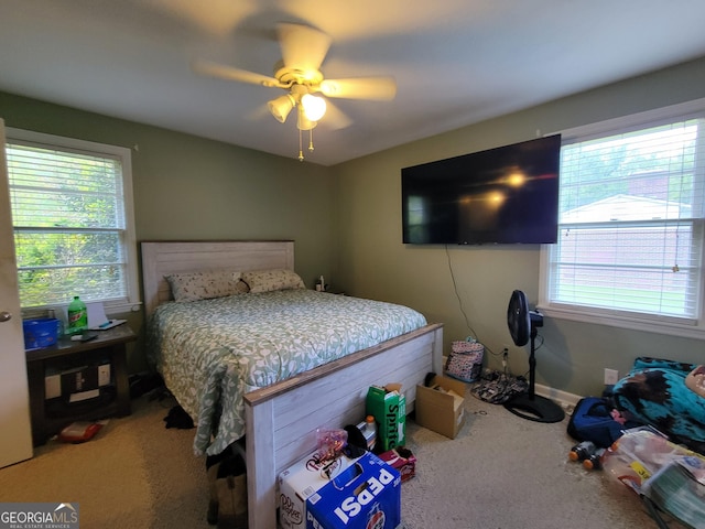 206 New Dr, Claxton, GA 30417 - bedroom with multiple windows, carpet, and a ceiling fan
