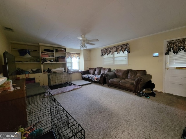 206 New Dr, Claxton, GA 30417 - carpeted living room featuring crown molding, ceiling fan, and visible vents