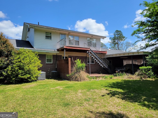 206 New Dr, Claxton, GA 30417 - back of house featuring a lawn, brick siding, and stairs