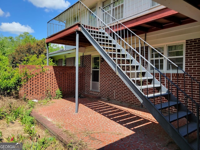 206 New Dr, Claxton, GA 30417 - exterior space featuring brick siding and a patio area