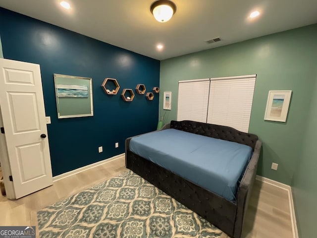 bedroom featuring visible vents, recessed lighting, baseboards, and wood finished floors