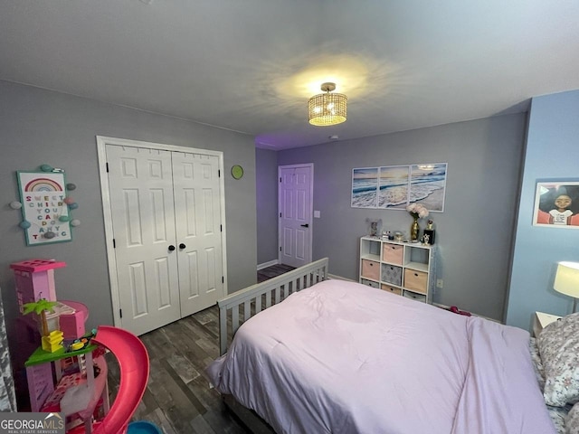 bedroom with a closet and wood finished floors