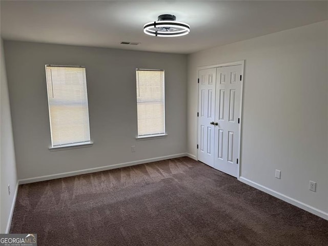 bathroom featuring vanity, wood finished floors, toilet, and washtub / shower combination