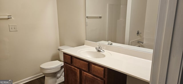 2867 Snapfinger Mnr, Decatur, GA 30035 - bathroom with baseboards, wood finished floors, vanity, and toilet