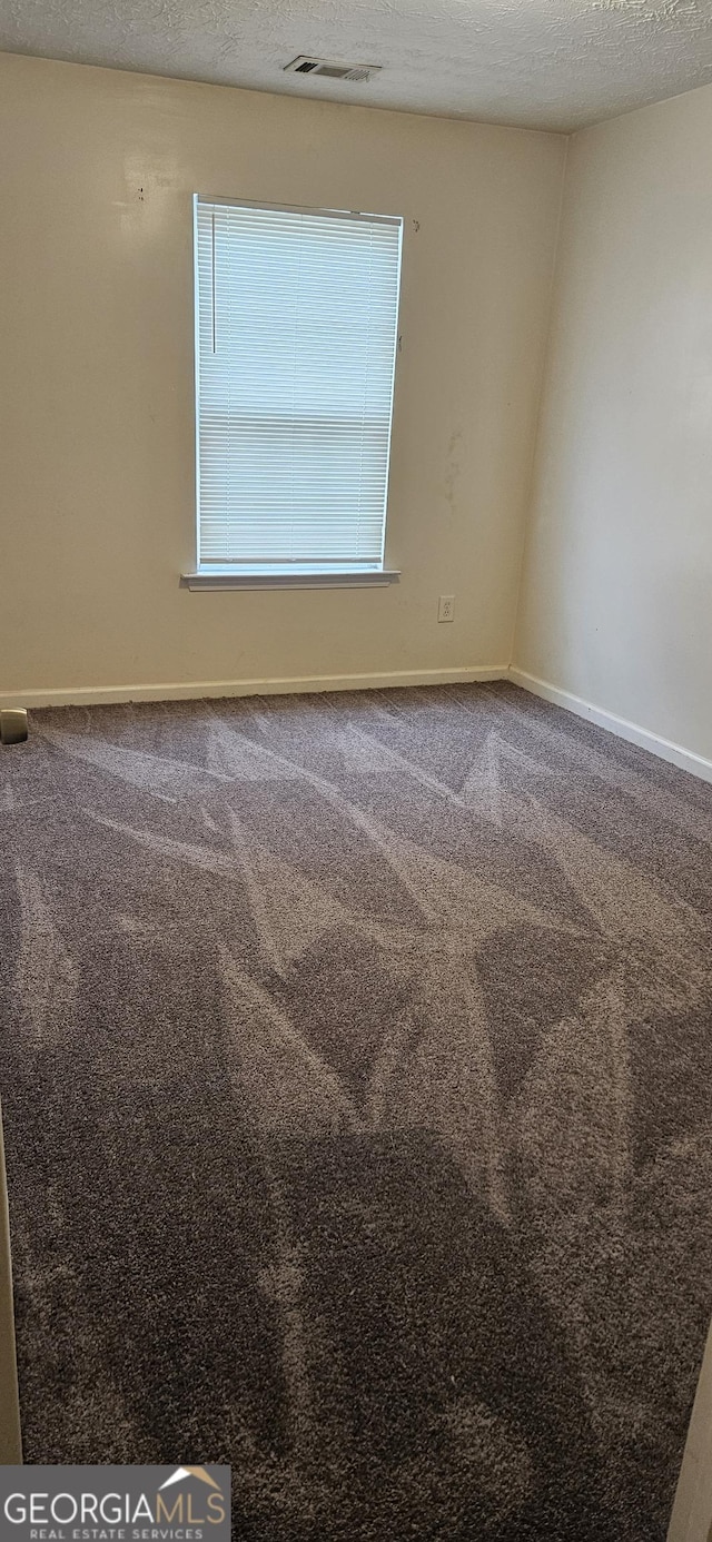 2867 Snapfinger Mnr, Decatur, GA 30035 - unfurnished room featuring baseboards, visible vents, and carpet