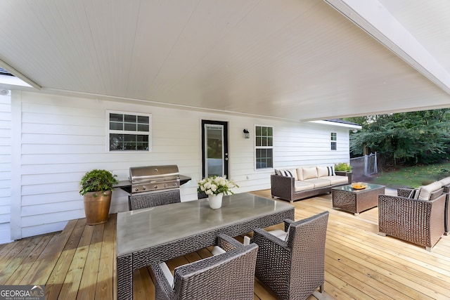 wooden deck featuring outdoor dining space, outdoor lounge area, and area for grilling