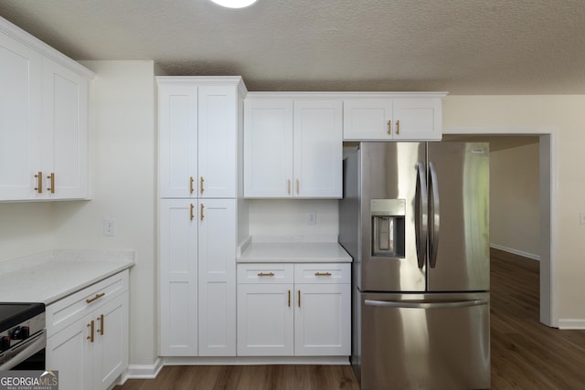kitchen featuring white cabinets, light countertops, dark wood-style floors, and stainless steel appliances