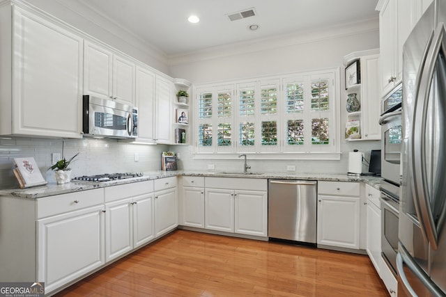 104 Glentown Way, Sandy Springs, GA 30328 - kitchen featuring visible vents, crown molding, open shelves, a sink, and stainless steel appliances