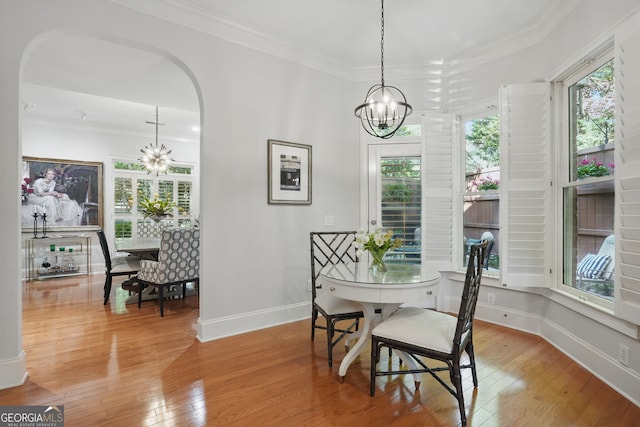 104 Glentown Way, Sandy Springs, GA 30328 - dining space featuring arched walkways, hardwood / wood-style floors, and a chandelier